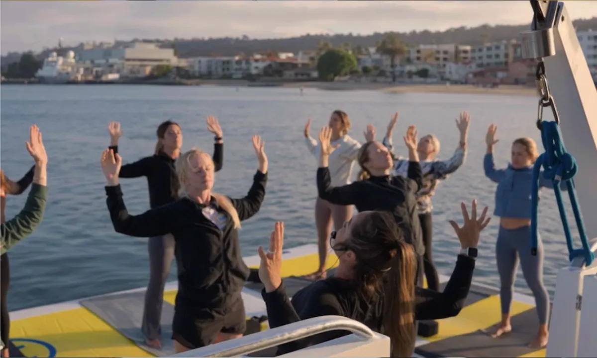 Yacht yoga floats on the bay