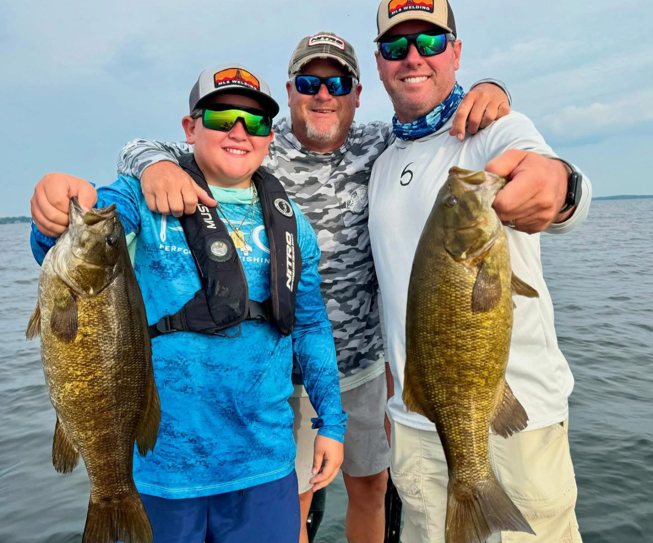 Happy customer holding a huge bass
