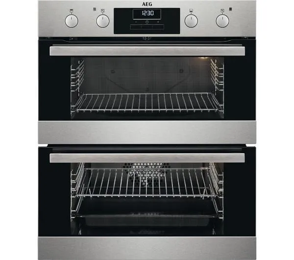 Double oven, both sparkling and hygienic after a professional cleaning service removed all food residue and dirt.