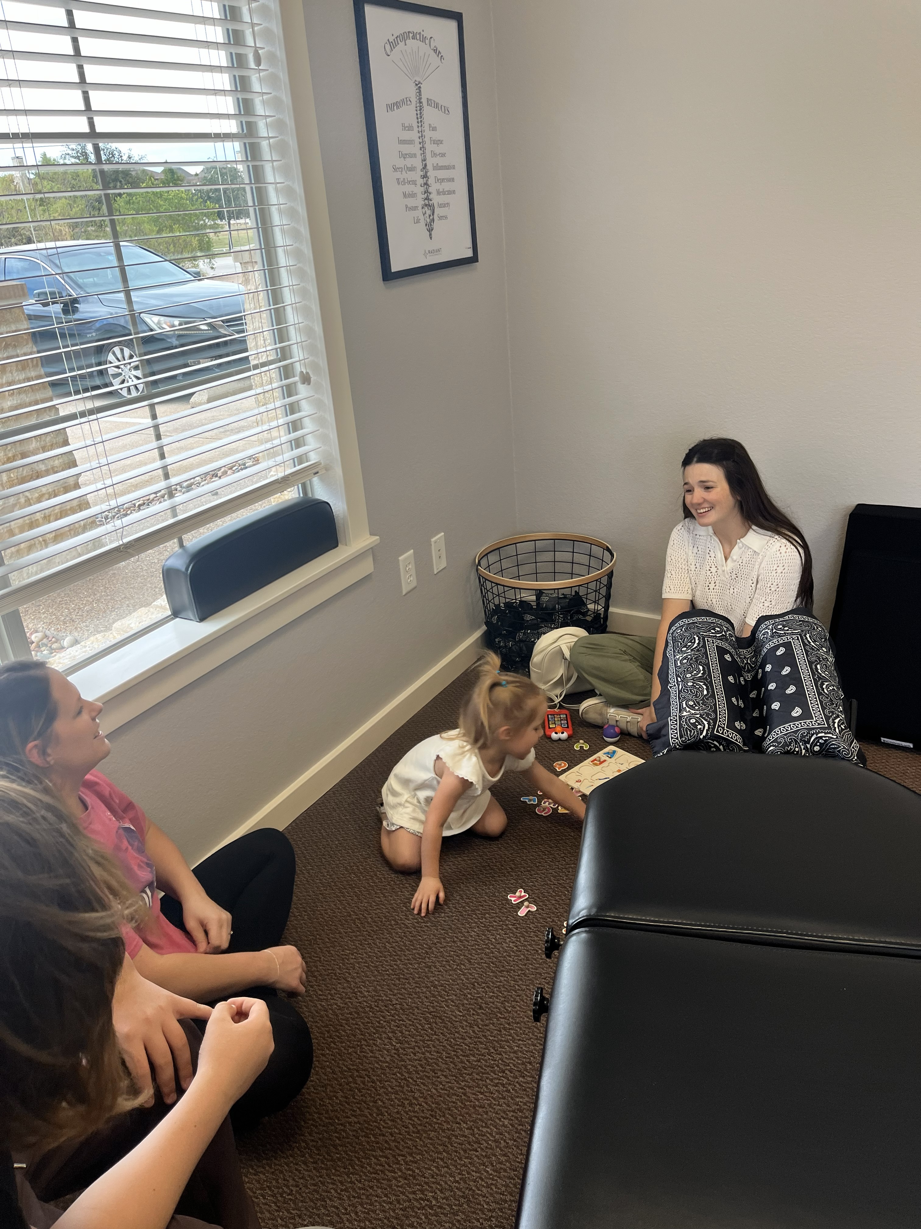 a skeleton laying on its back on a pink surface