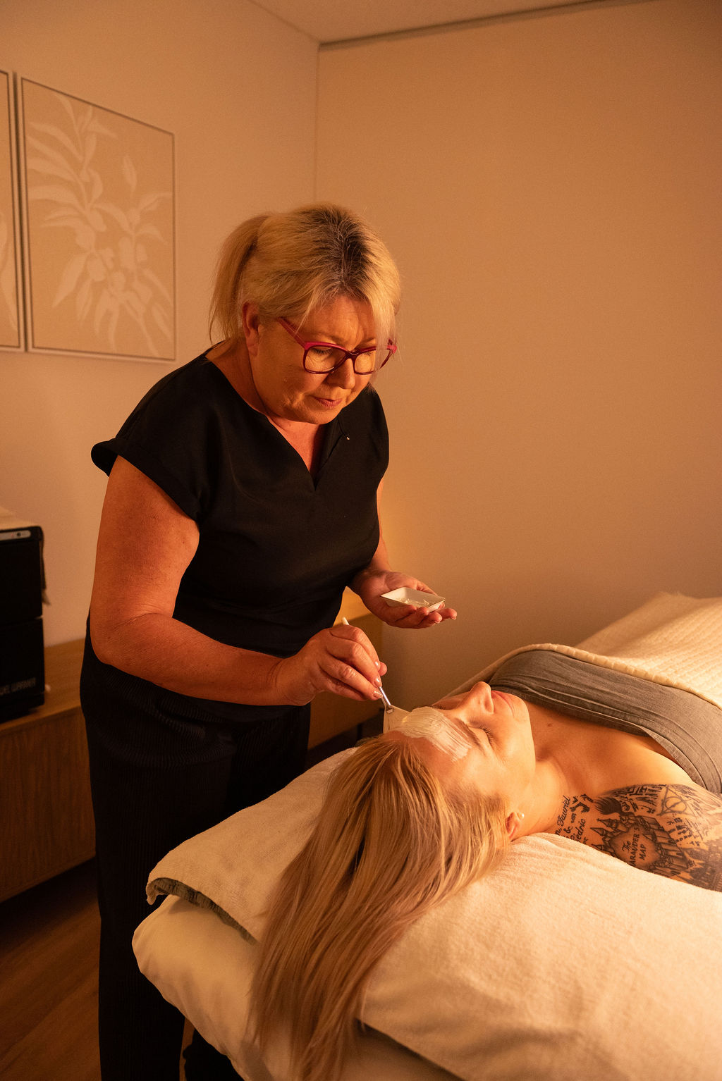 Woman experiencing a signature botanical facial and brow artistry