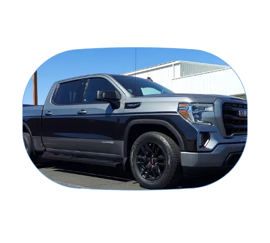 Image of a grey pickup truck that has a vehicle stripe wrap along the side.