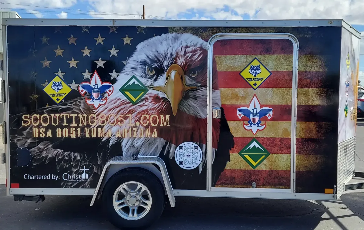 An image of a tow-behind trailer with a graphic wrap