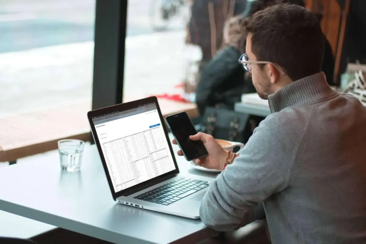 man on laptop looking at ETF