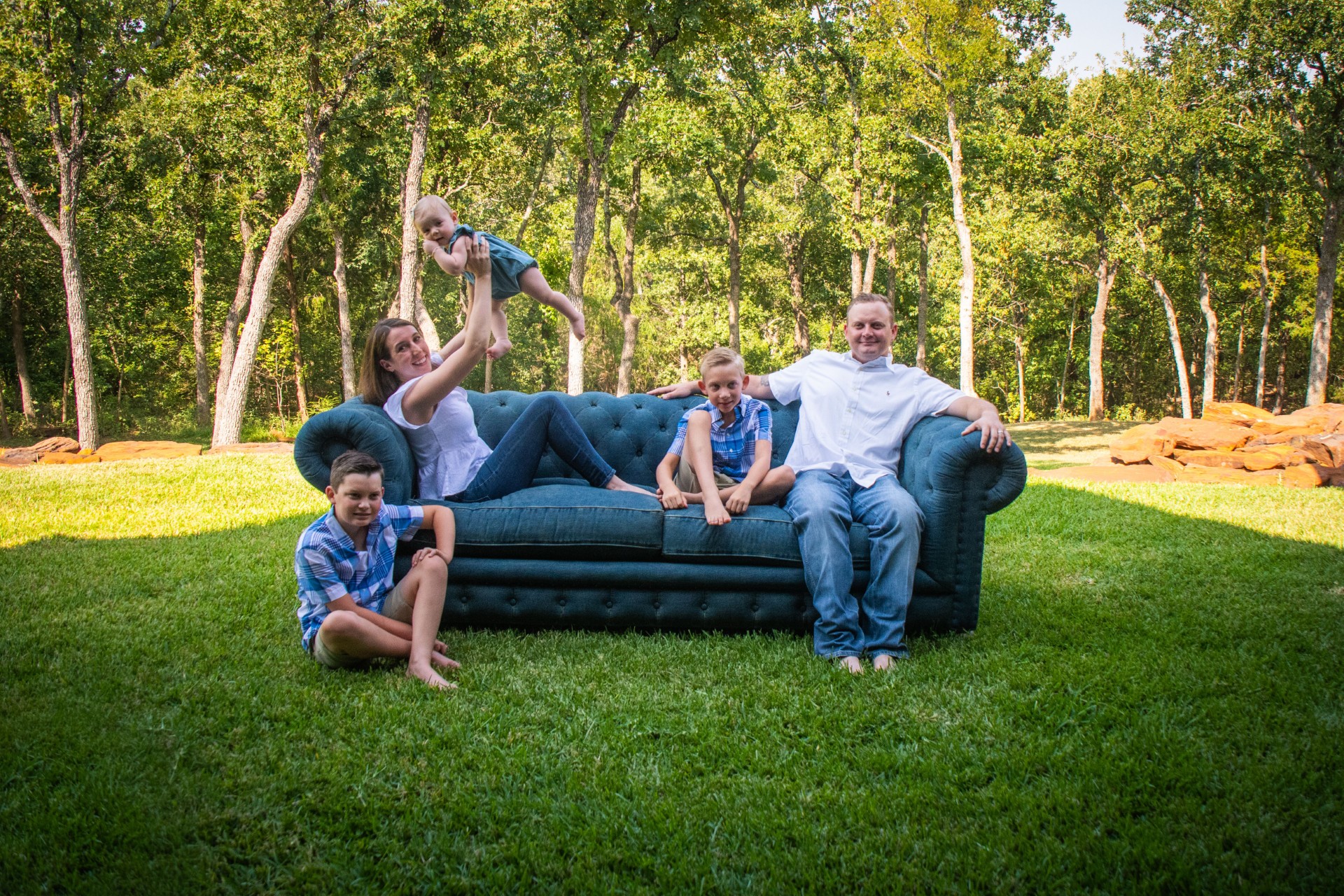 Our family gathered together outdoors, smiling at the camera