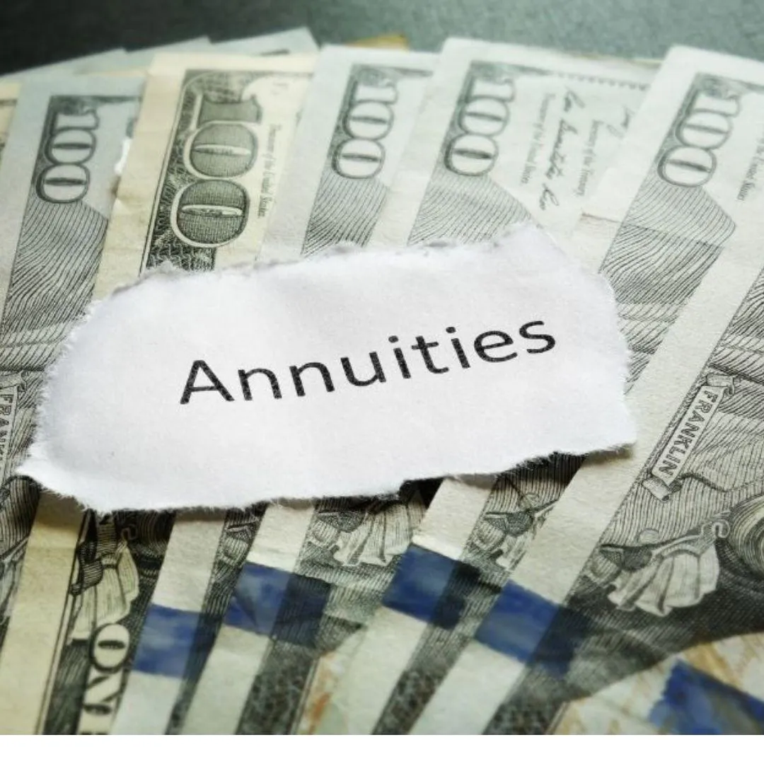 Notes the reads "annuities" on a stack of cash