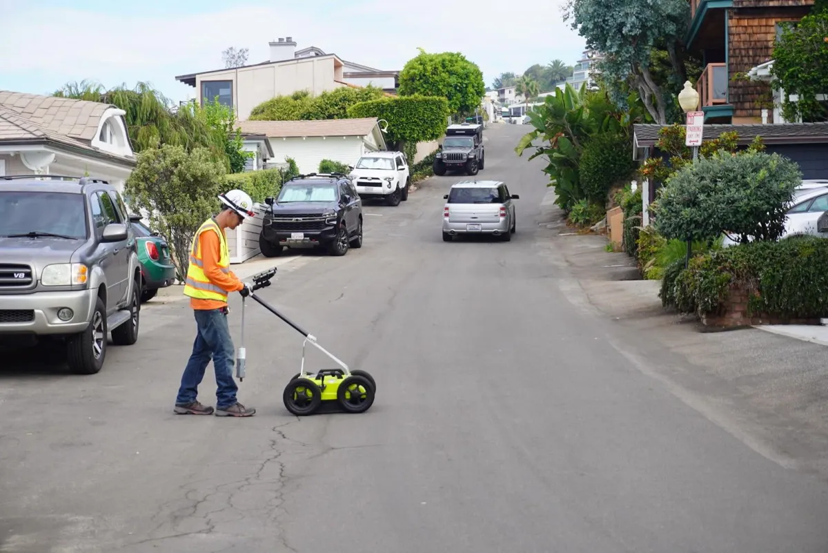 Worker performing utility locating