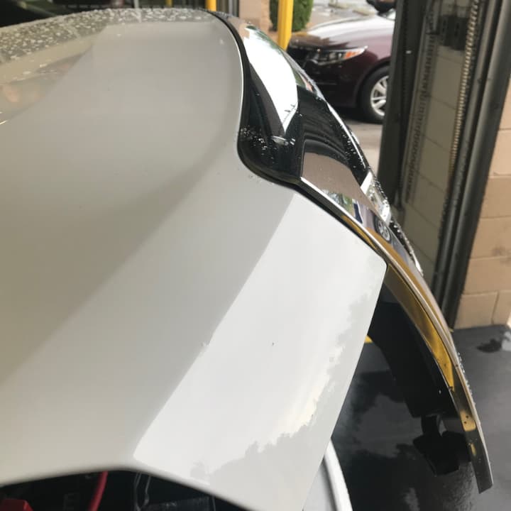 paintless dent repair on car hood in Palm Coast