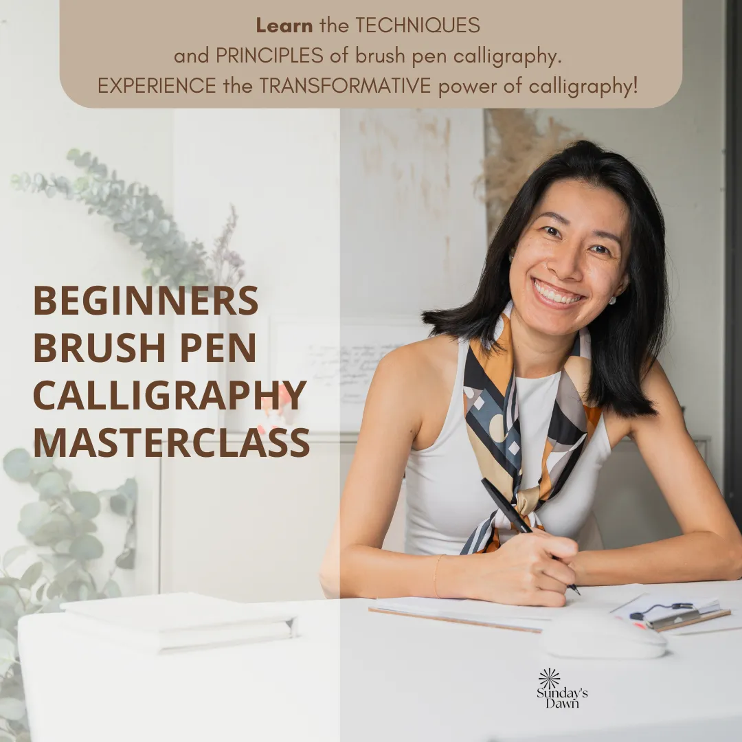 Artist writing calligraphy on large white paper