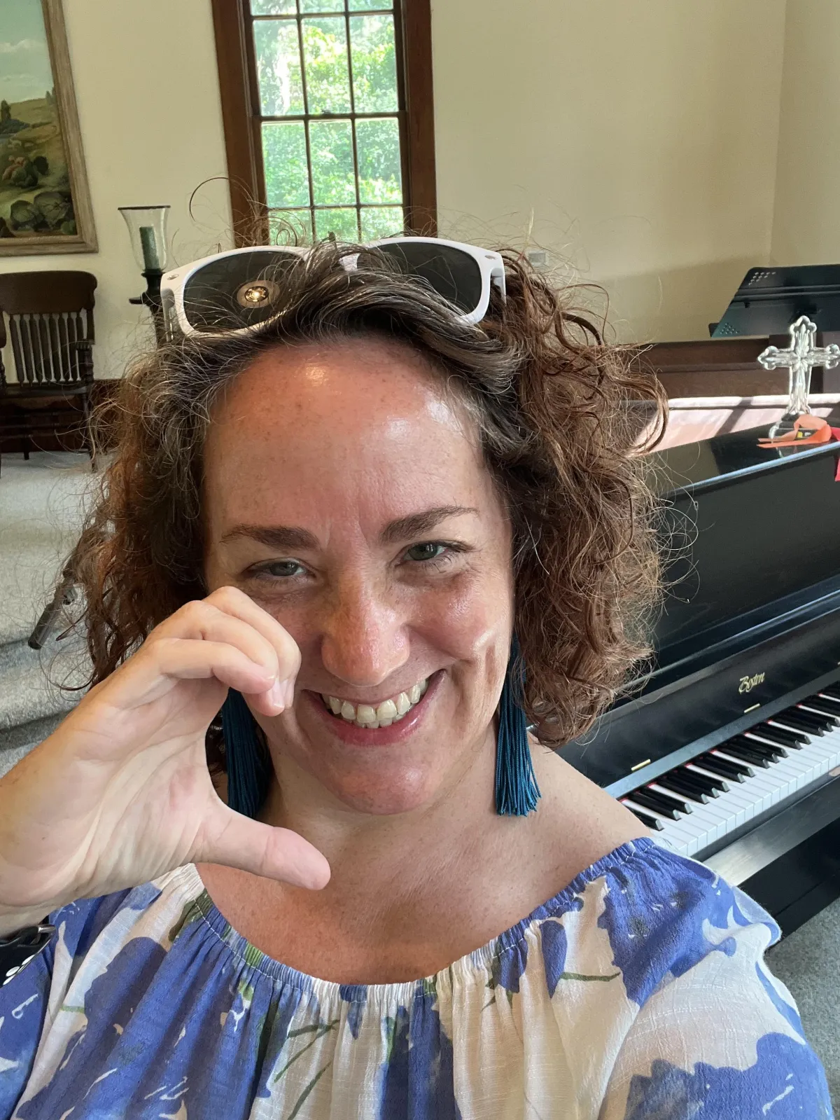 Photo of Midge with piano in background, music lessons