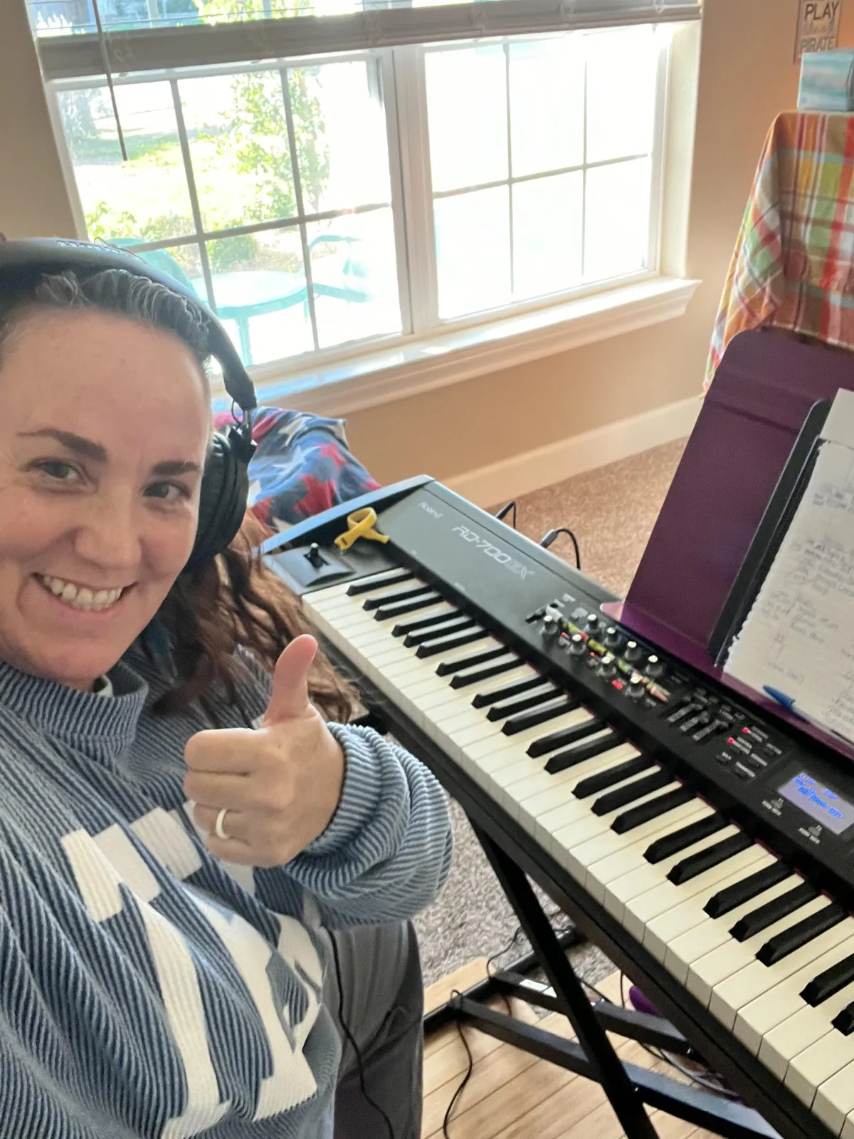 Midge with her electric piano recording custom tracks for students
