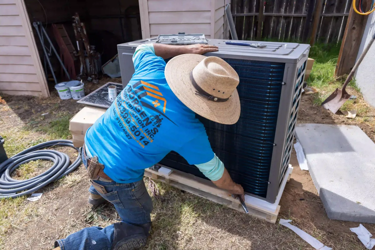 Borgen’s Construction HVAC technician installing and servicing residential ductwork and ventilation systems at a home in Fresno, CA