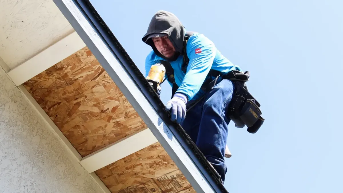 Borgen’s Construction roofing technician installing and securing residential roof edge flashing and fascia trim on a home in Fresno, CA