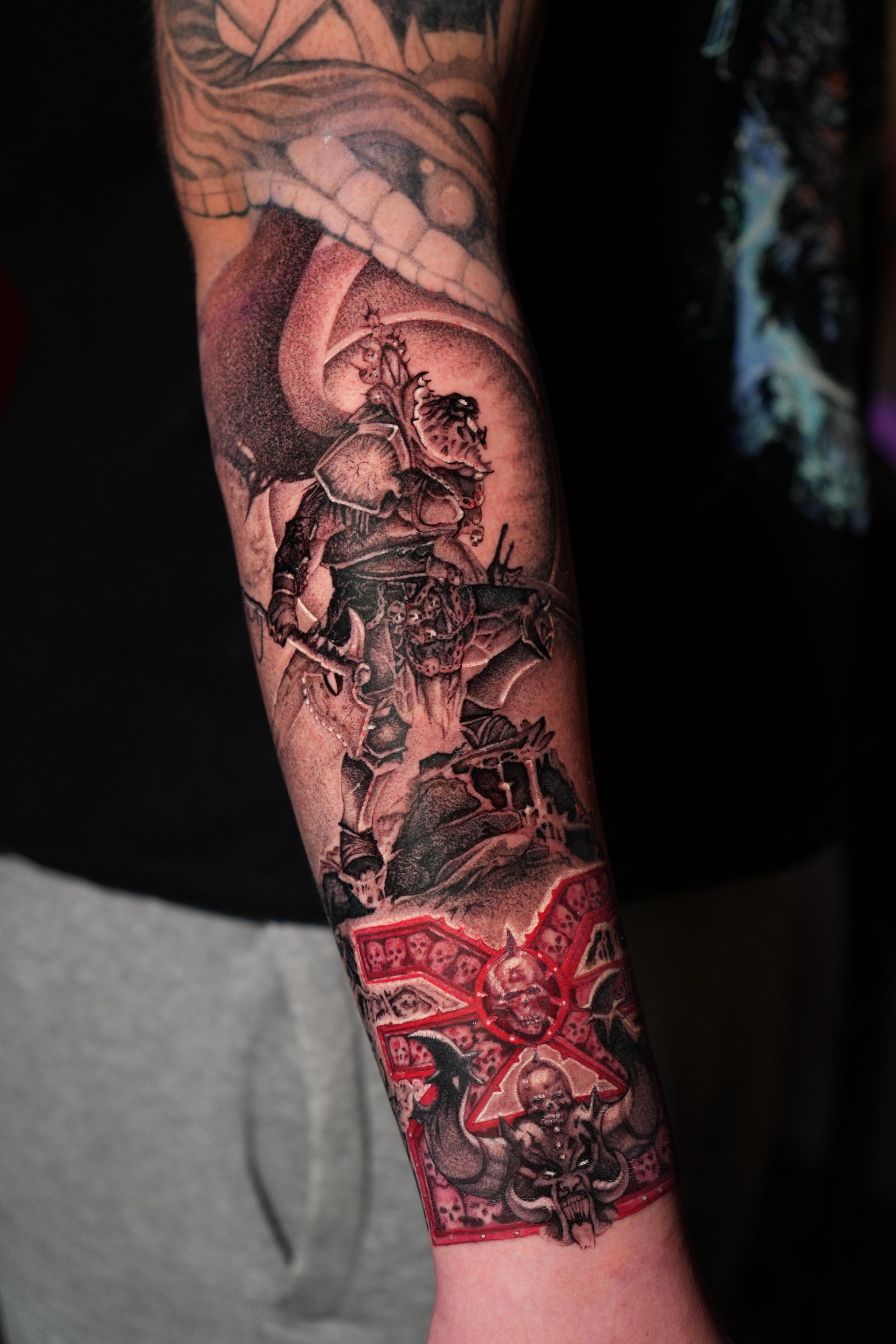 person with tattoo on right arm