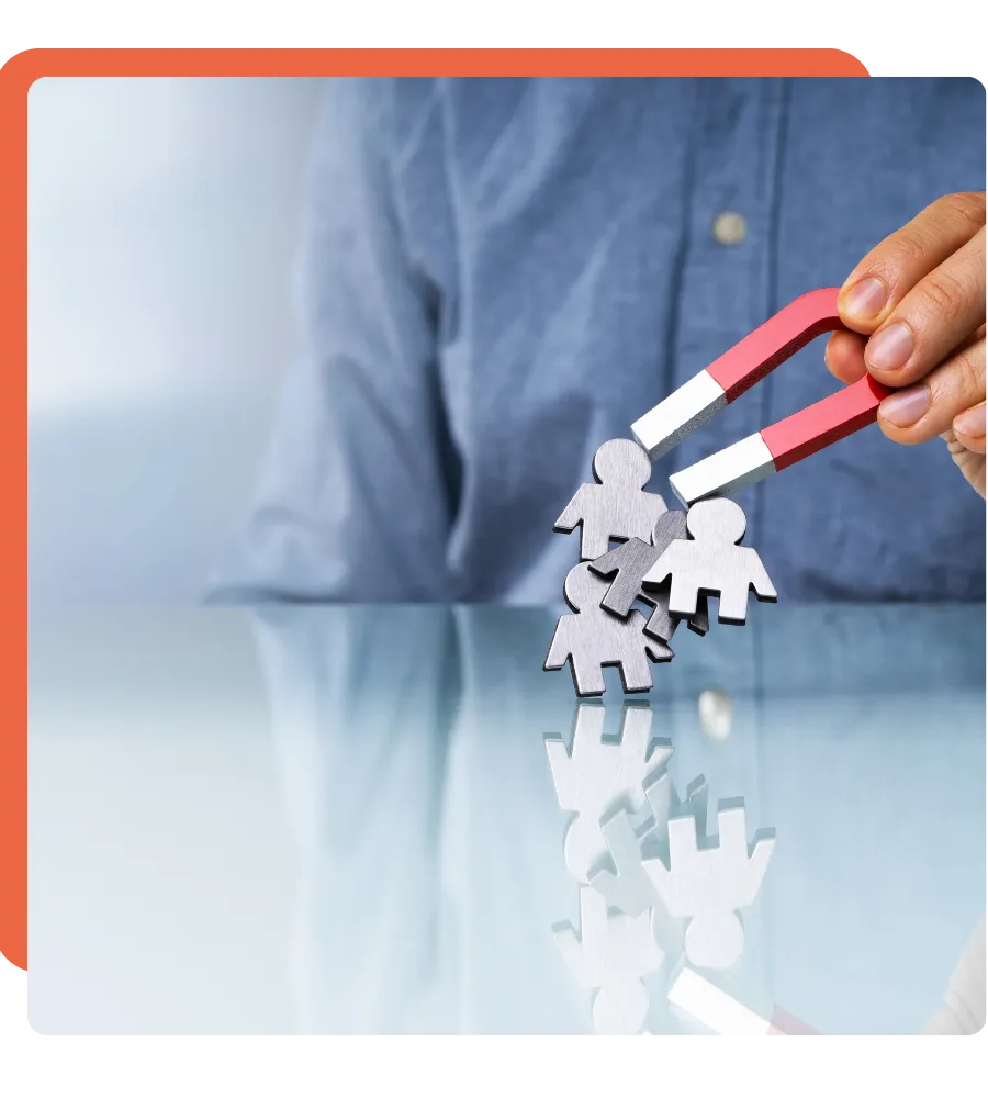A hand holding a powerful magnet attracting a group of people, symbolizing strong leadership and influence.