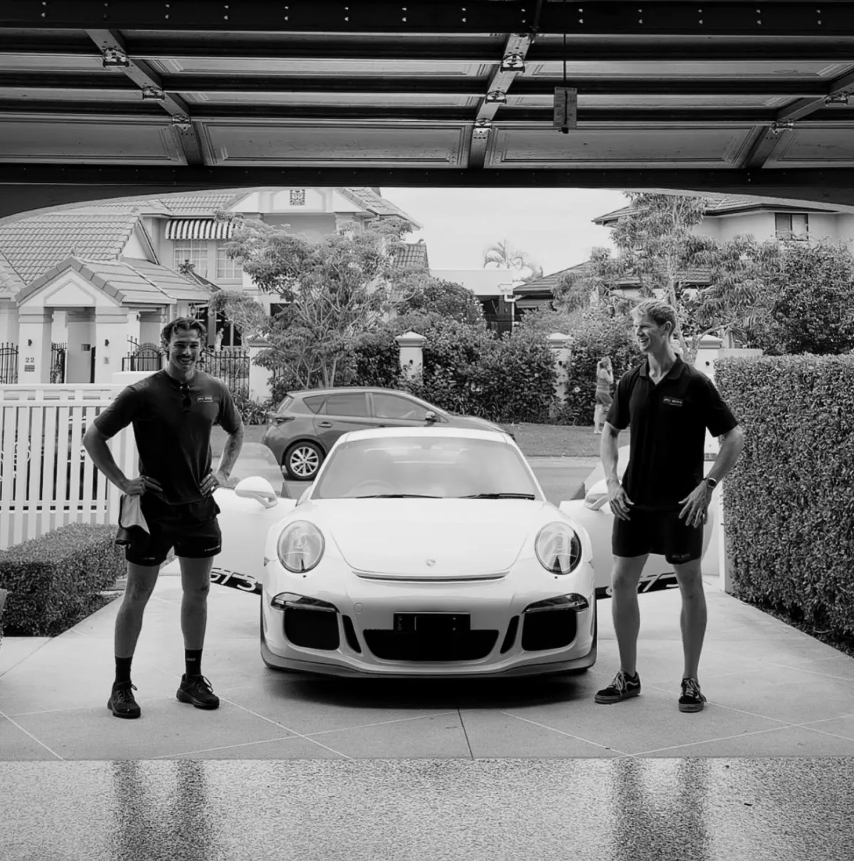 a group of cars parked on a brick road
