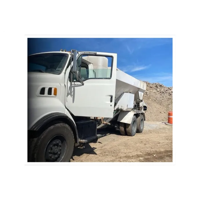 Volumetric ready-mix concrete truck delivering high-quality, fresh concrete for a construction site.