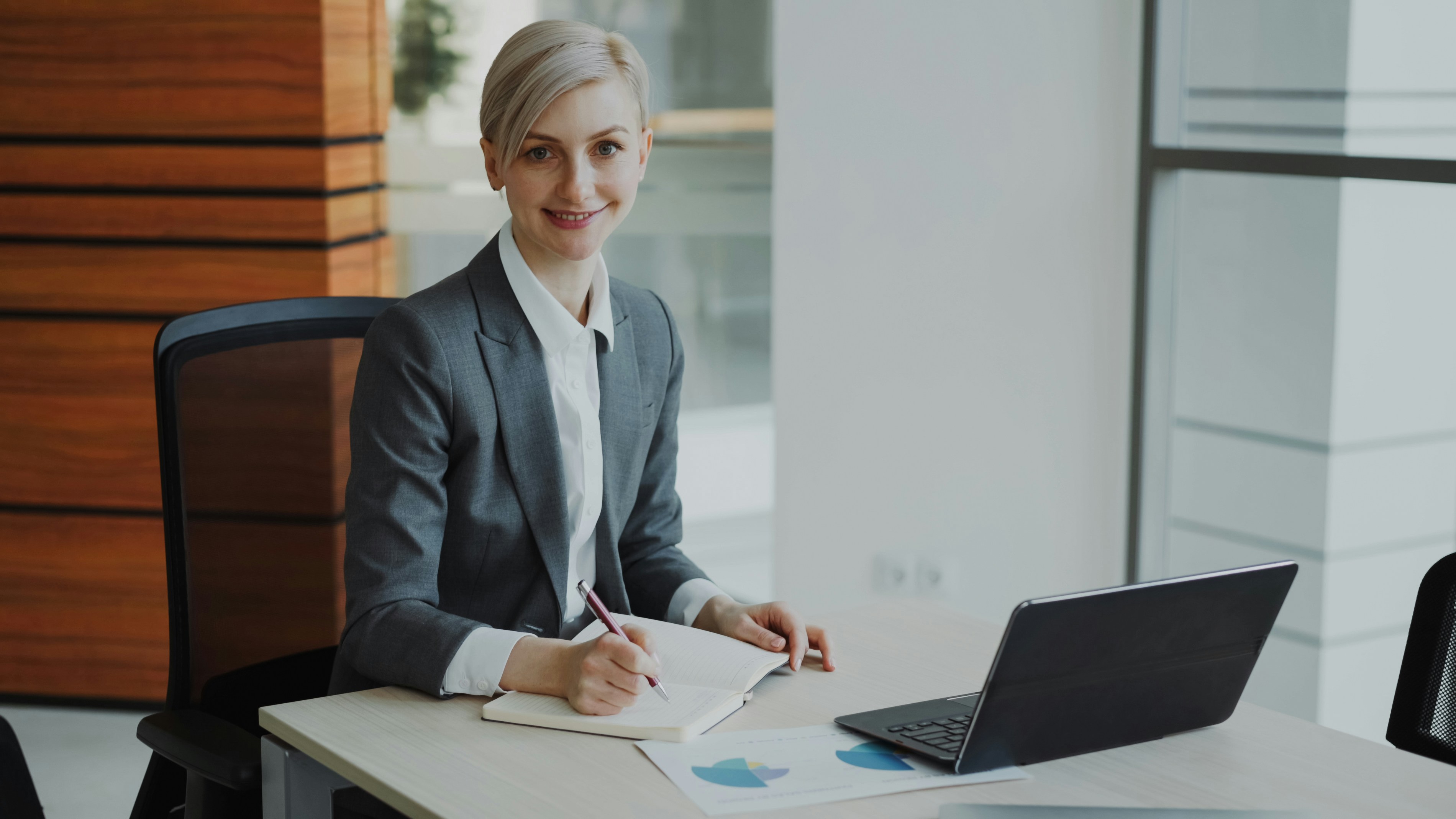 Confident women at desk