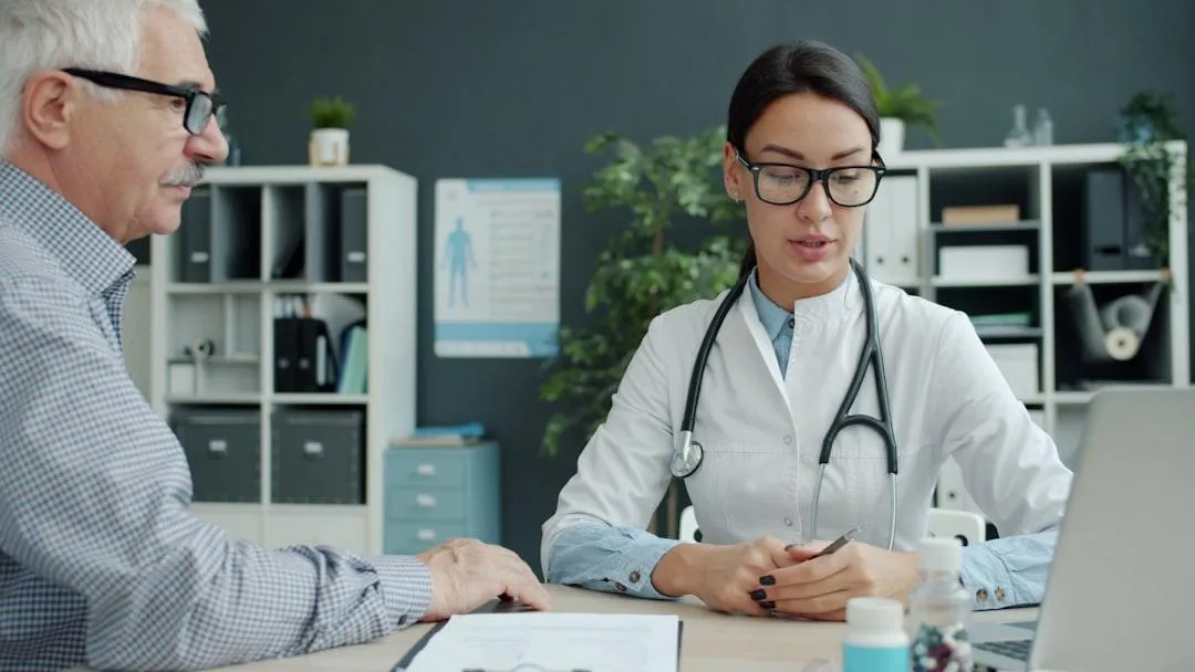 medical professional discussing care plans with an older adult