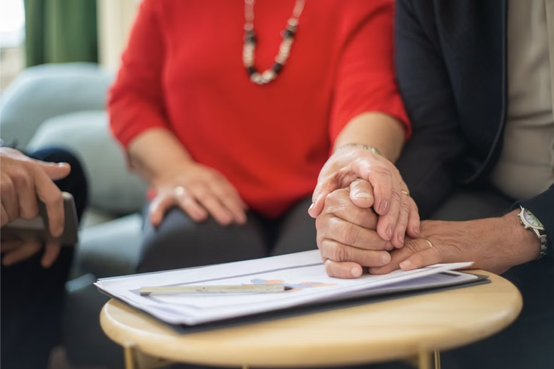 Family reviewing senior care contracts and pricing options