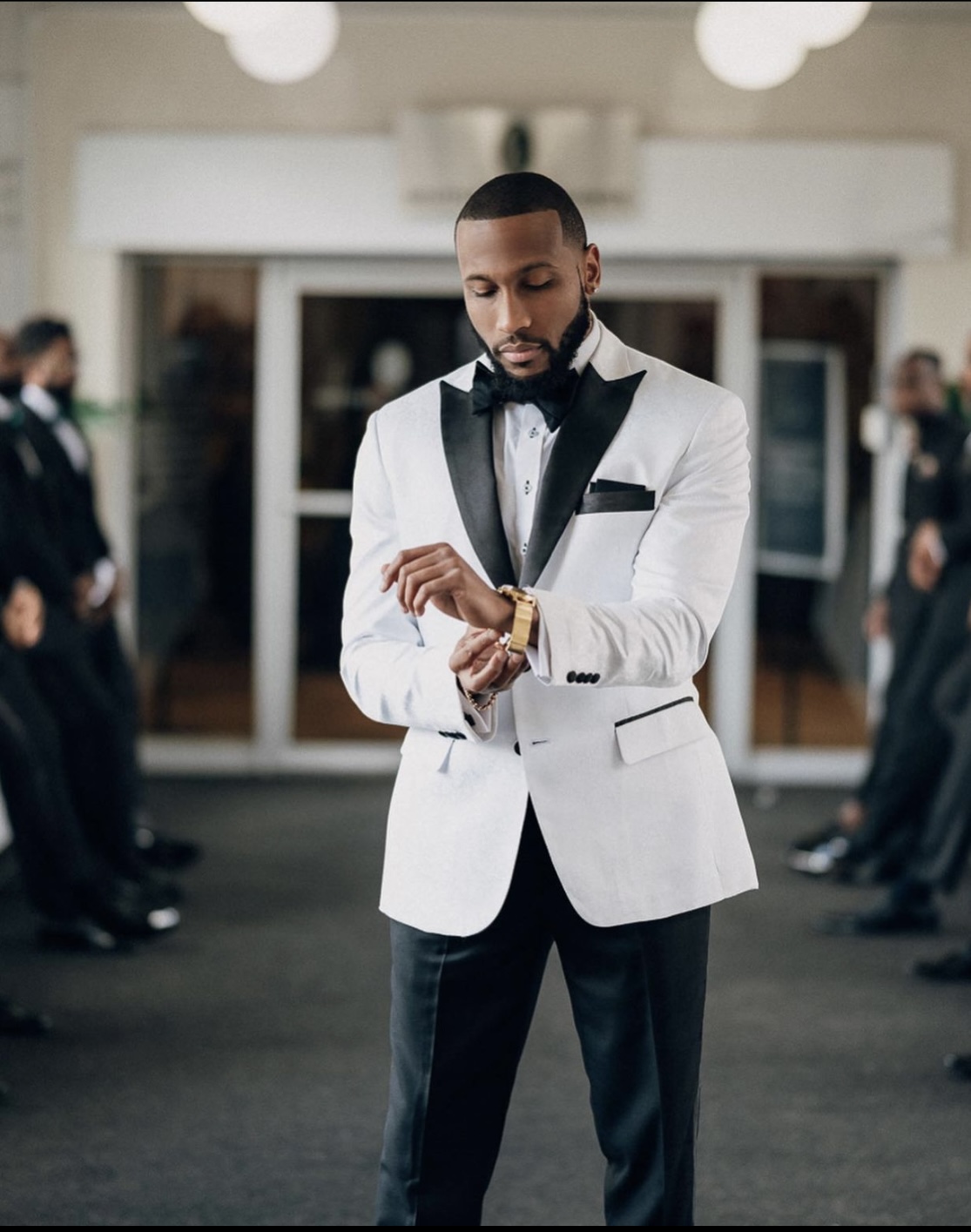 Couple holding hands in a dry, desolate landscape.