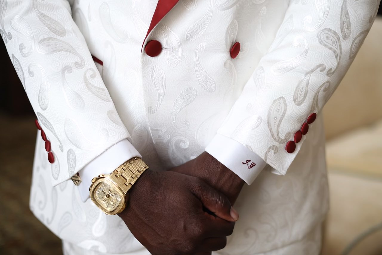 person wearing peaked lapel suit jacket