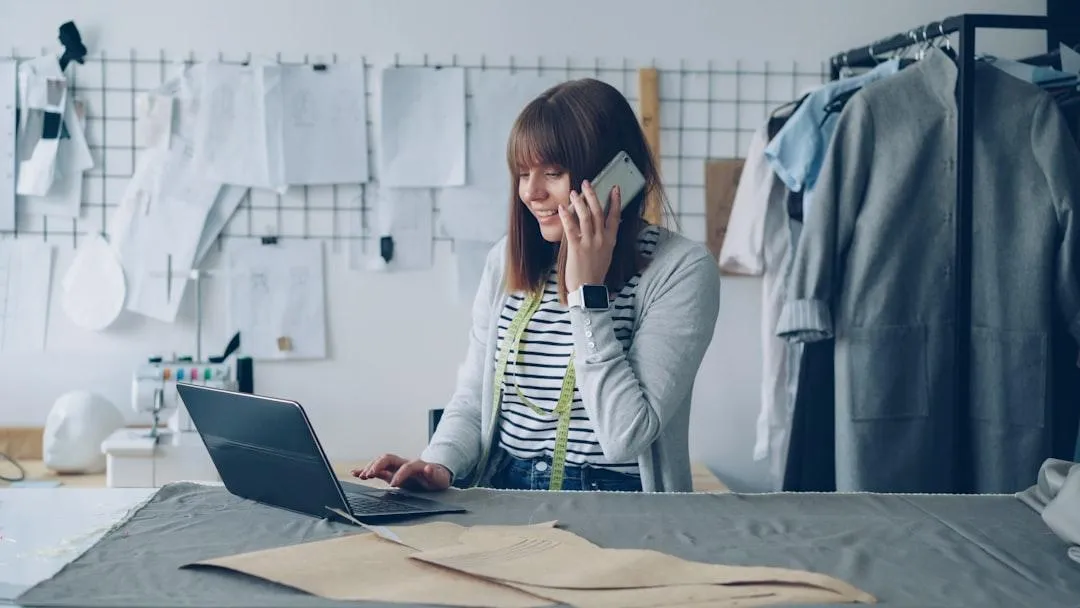 woman on phone at computer