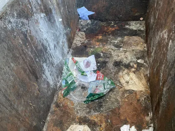 Trash bin interior visibly clean and free of debris after professional washing