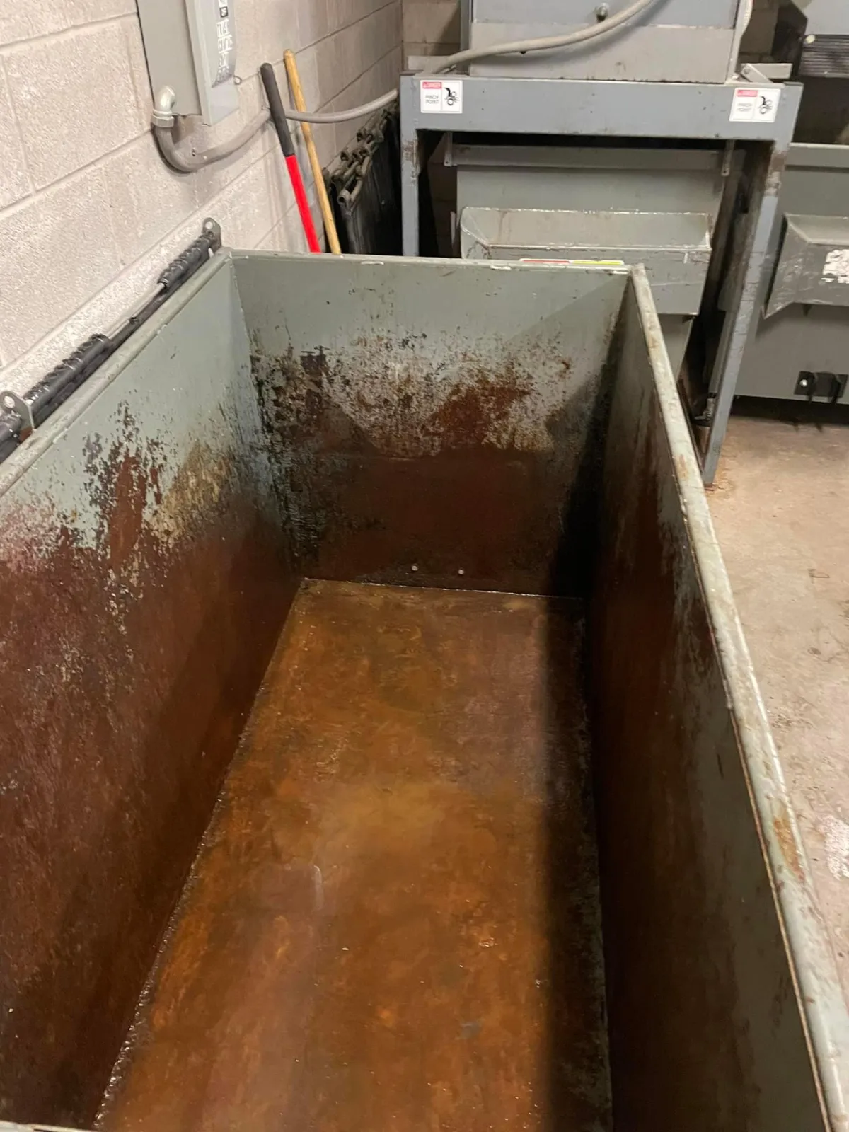 Trash bin interior visibly clean and free of debris after professional washing