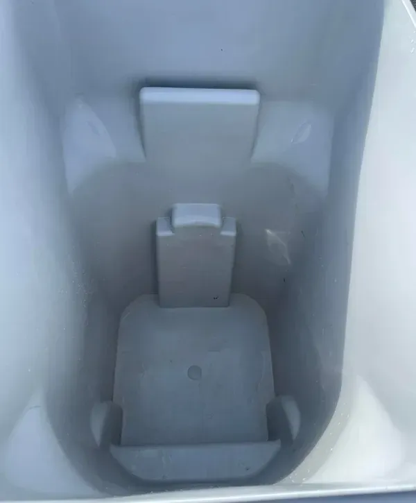 Clean gray trash bin interior after professional sanitizing.