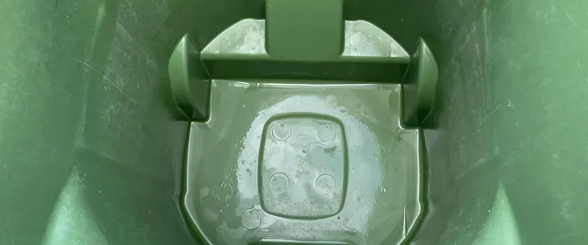 Close-up of a residential trash bin interior after professional trash bin cleaning and sanitizing service.