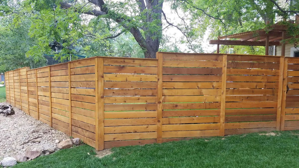 Modern horizontal cedar privacy fence installation in San Antonio backyard