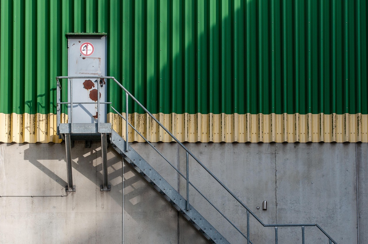 Red wooden door with a locked padlock