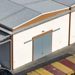 Large warehouse building with metal roofing system and commercial exterior structure