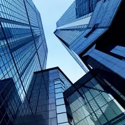 Modern office buildings with commercial roofing systems in urban corporate district