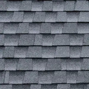 A close-up view of a Impact-Resistant Shingles roofing system showing the texture and overlapping pattern.