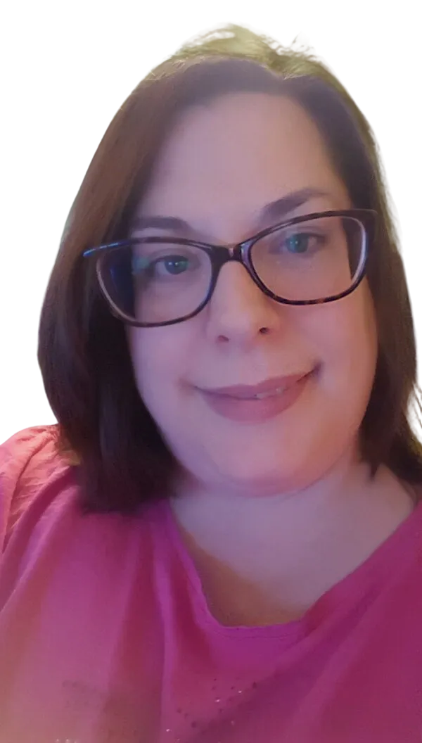 Confident female writer in a relaxed pose holding a notebook.