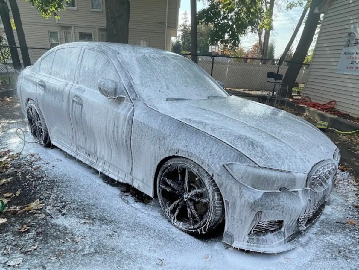 white car crossing body of water