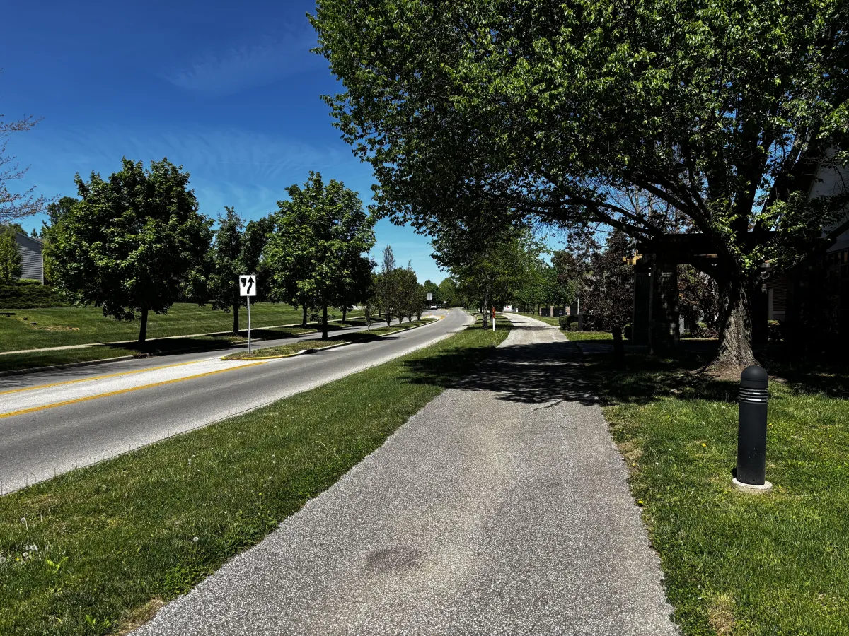 Tree-lined walking path along Sare Road in Bloomington, Indiana neighborhood