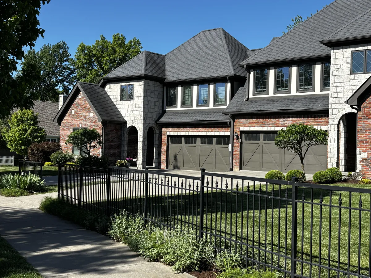 Condos in Renwick Springhouse Bloomington Indiana with brick, limestone, and landscaped entry