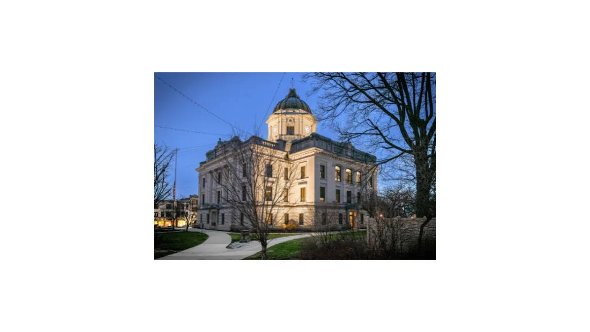 Bloomington Indiana courthouse square downtown with historic buildings and tree-lined street — Lesa Miller Real Estate