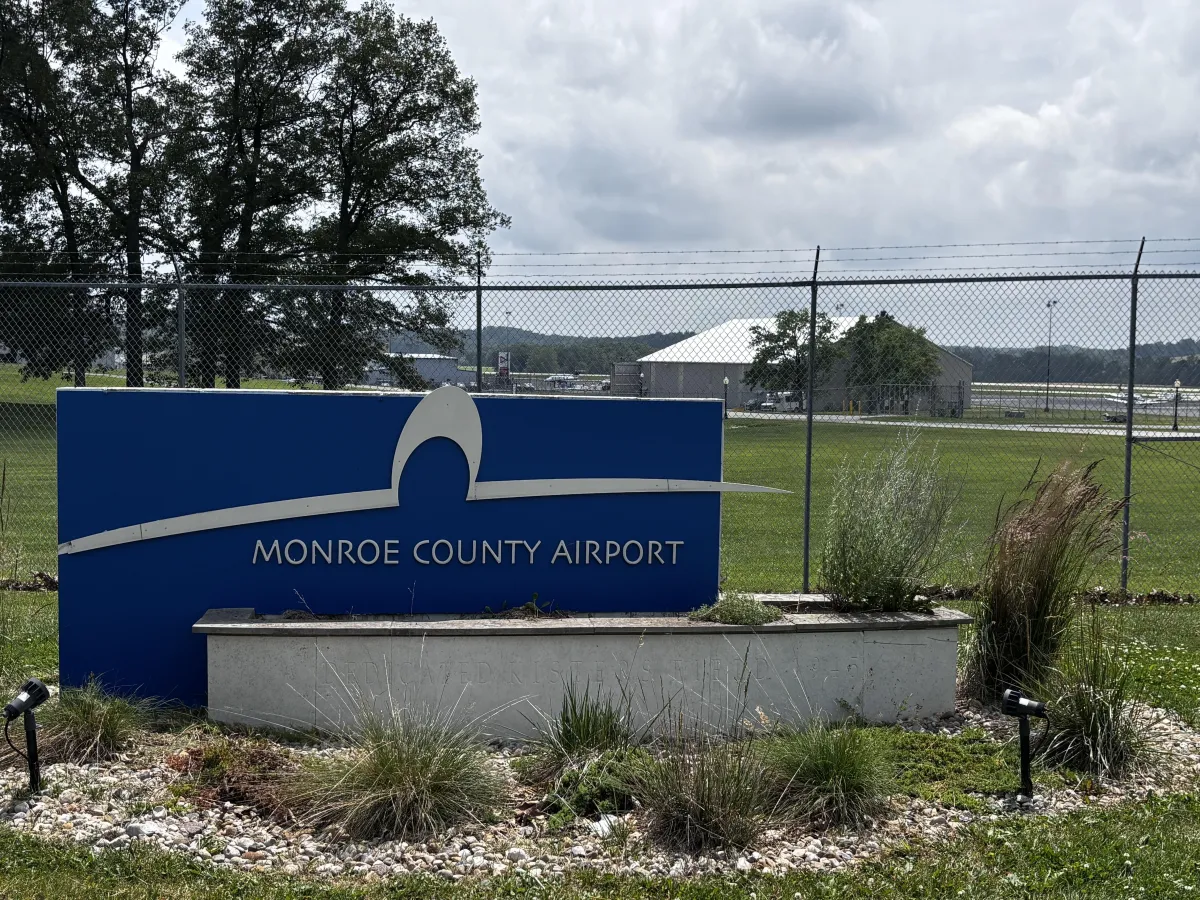 Aerial view of Monroe County Airport in Bloomington Indiana with runway and surrounding countryside