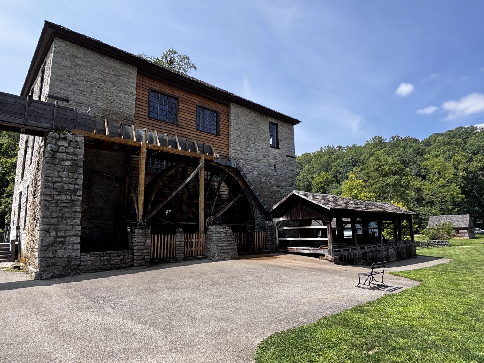 The limestone gristmill and wooden water wheel at Spring Mill State Park's Pioneer Village near Mitchell, Indiana