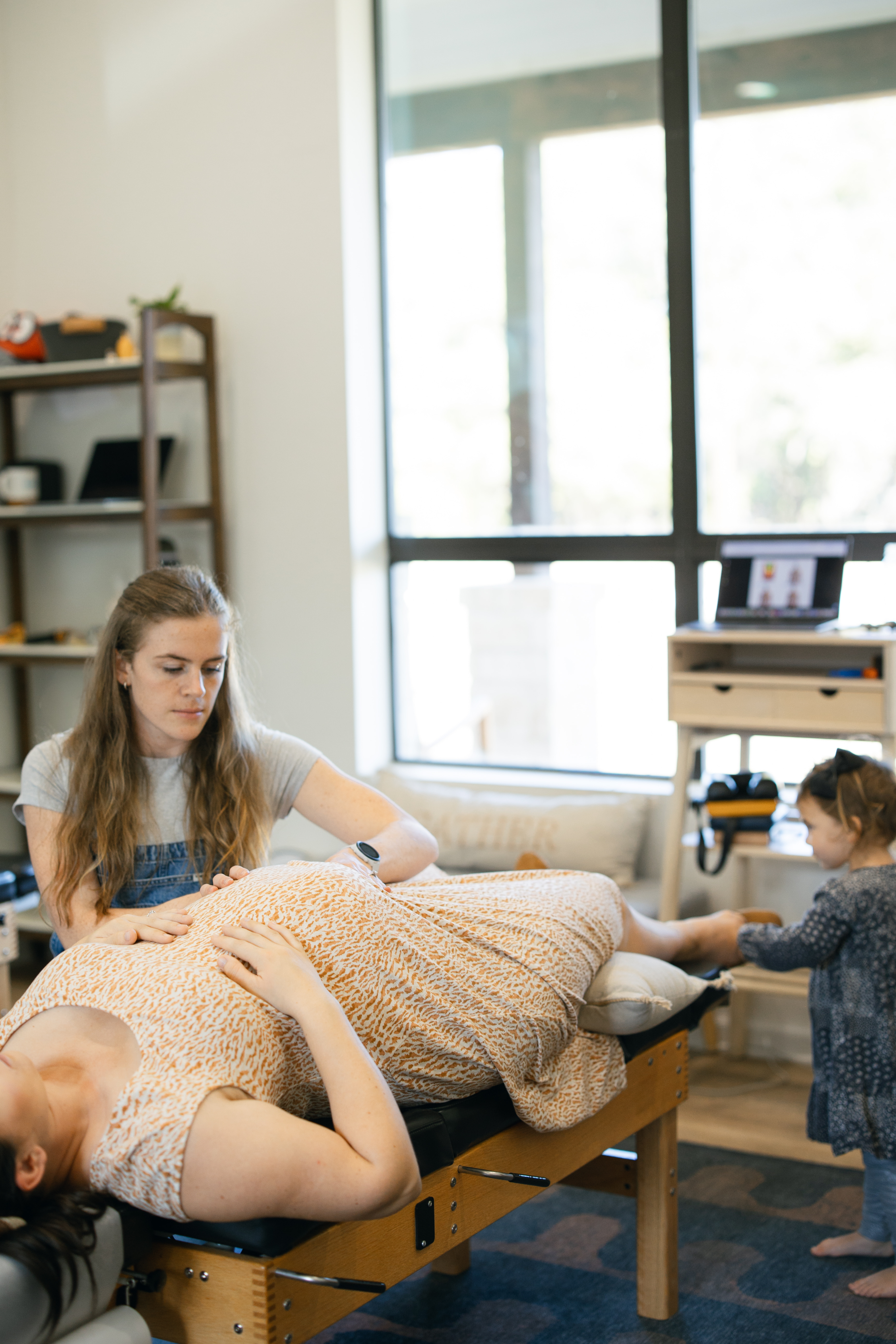 Prenatal chiropractic care - expecting mom in a calm clinic setting