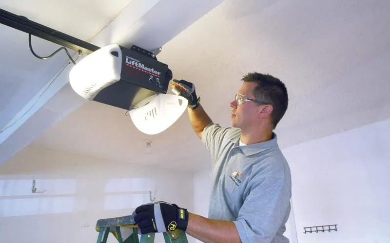 Jay repairing garage door opener