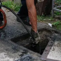 outside drain being cleared