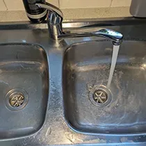 Water flowing in the faucet