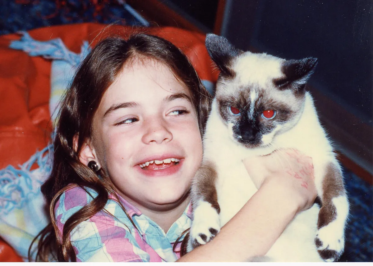 Girl holding cat