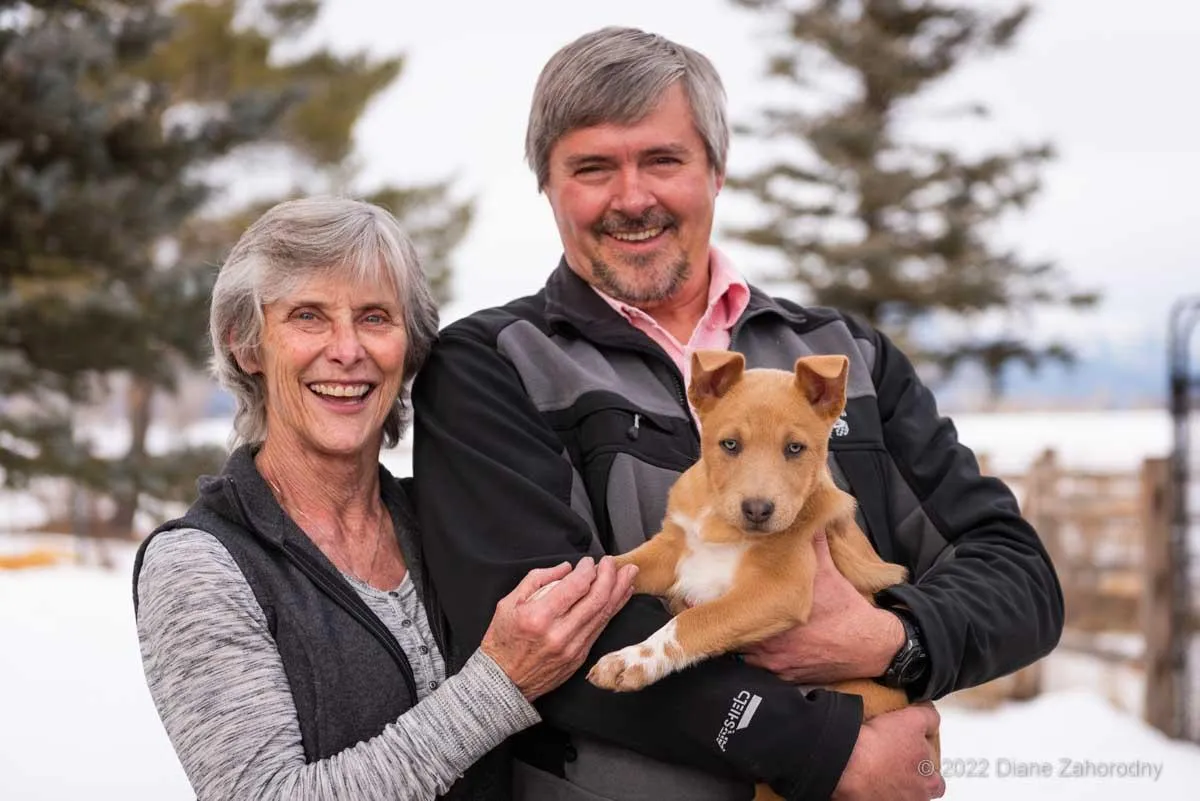 Couple holding puppy