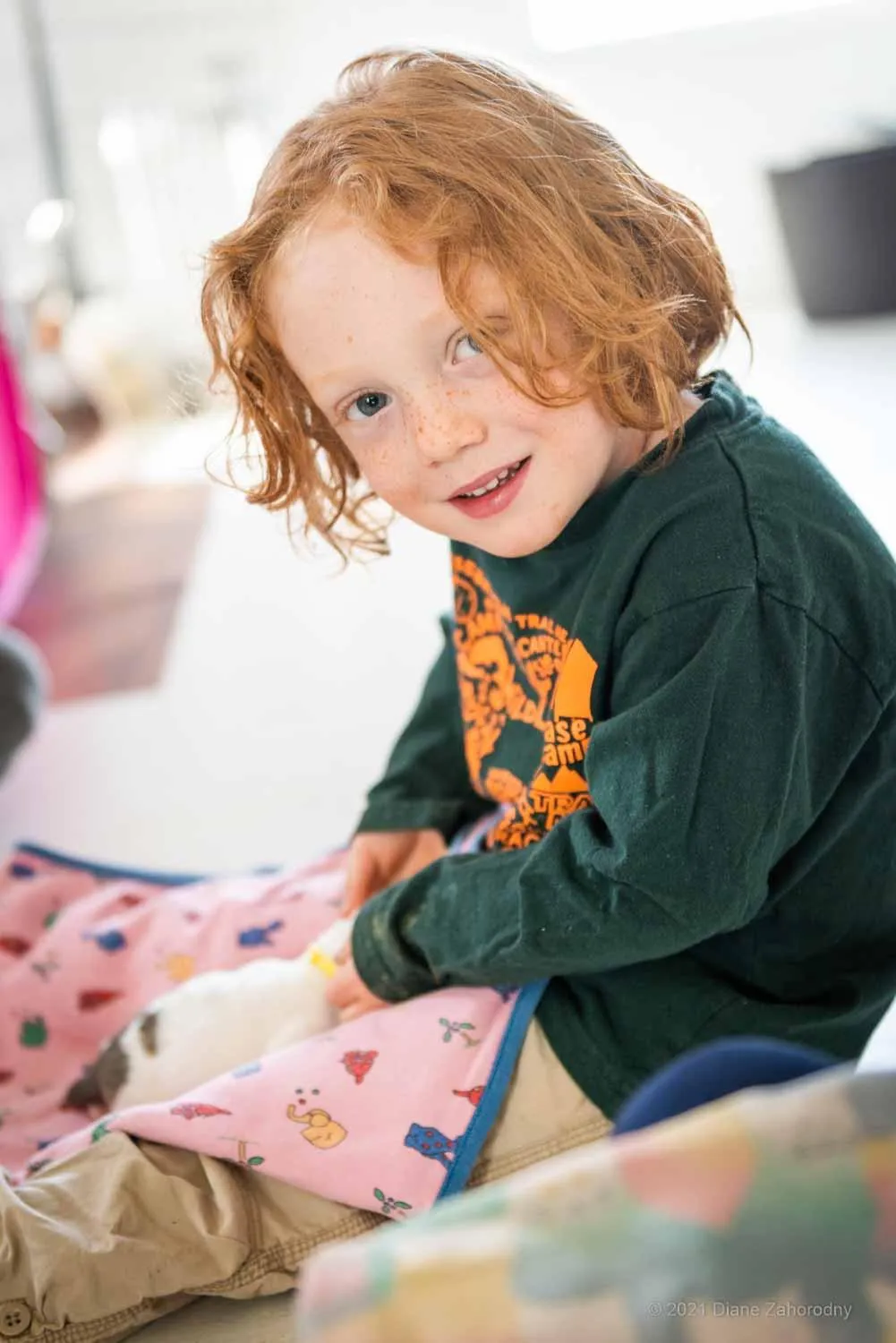 Smiling boy holding puppy